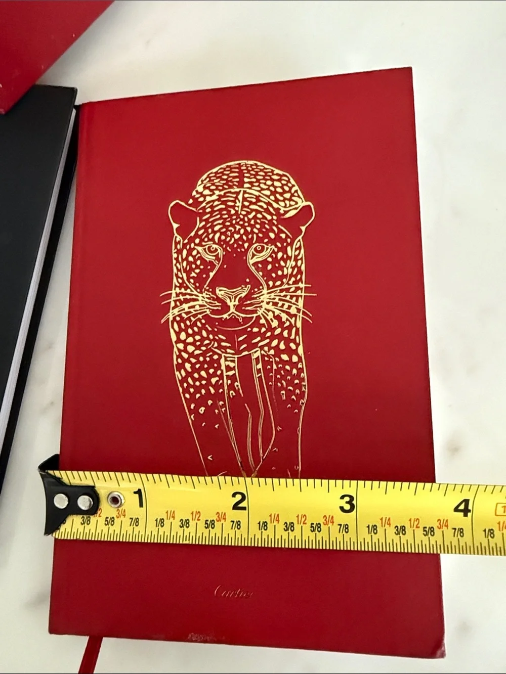 Cartier Red and Black Hardcover Notebooks with Gold Accents